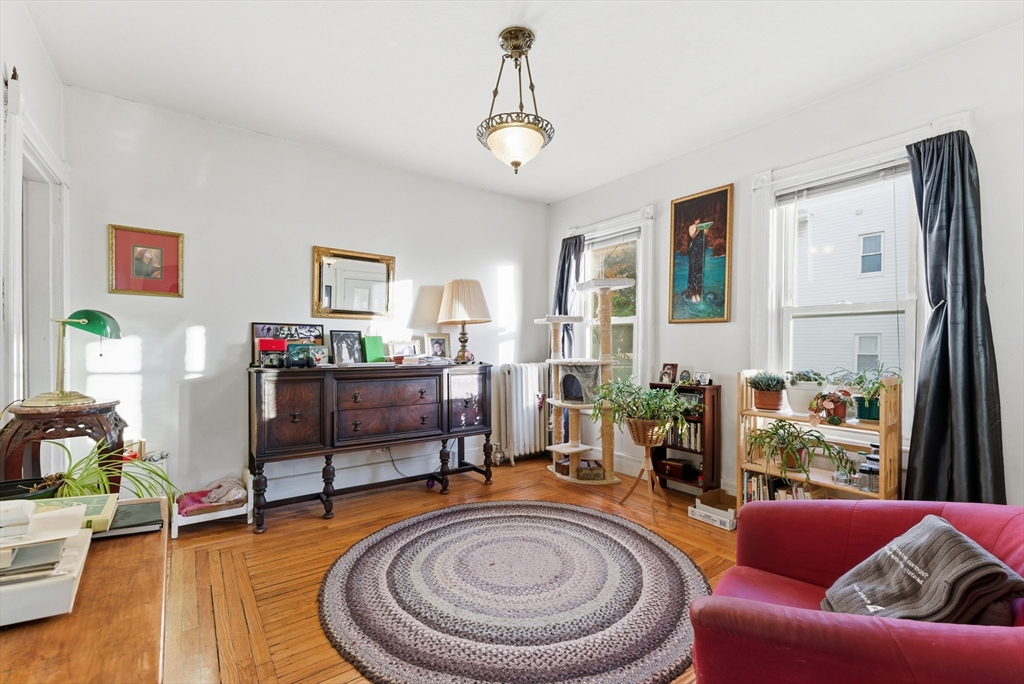 74-76 Maple Terrace West Springfield, MA 01089 - Photo 33 of 39 a living room with furniture and a chandelier