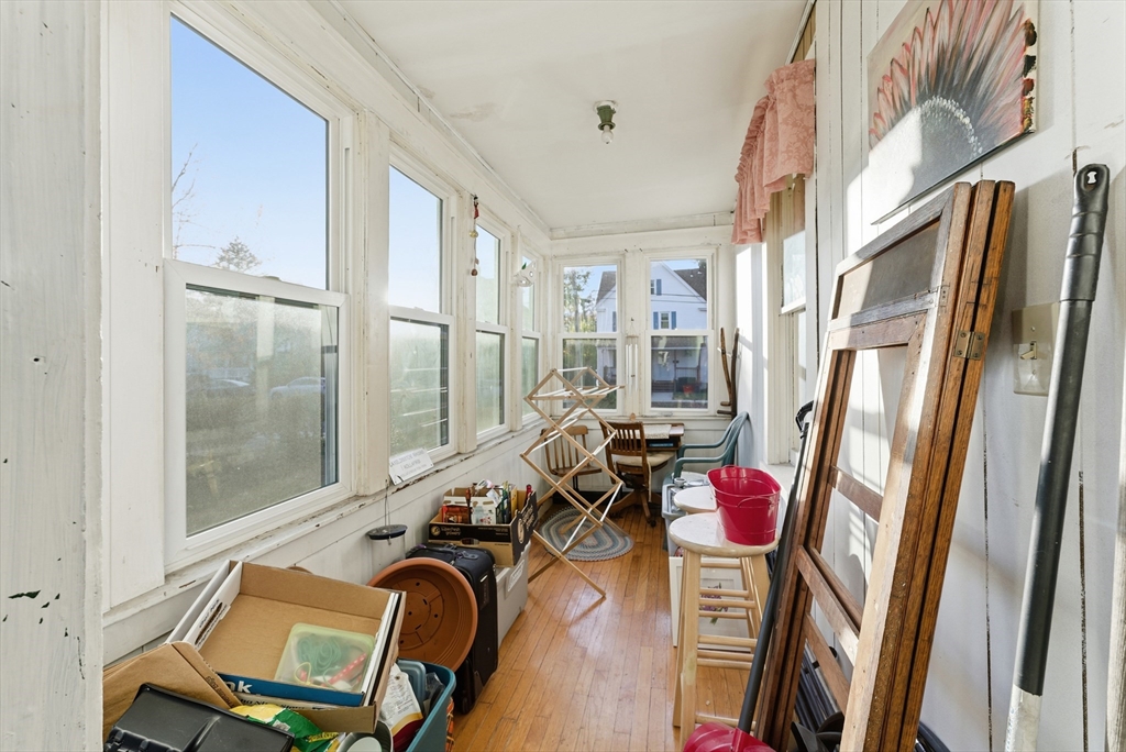74-76 Maple Terrace West Springfield, MA 01089 - Photo 36 of 39 a view of a livingroom with furniture hardwood floor and a ceiling fan