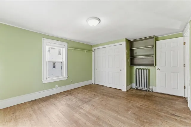 an empty room with closet area