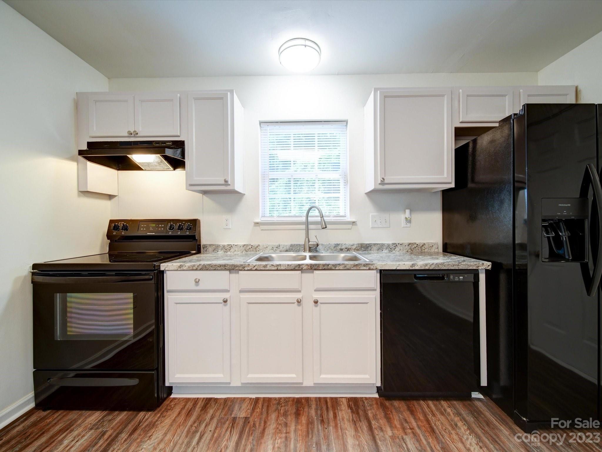 925 Key Street Charlotte, NC 28208 - Photo 13 of 41 a kitchen with a sink stove and refrigerator