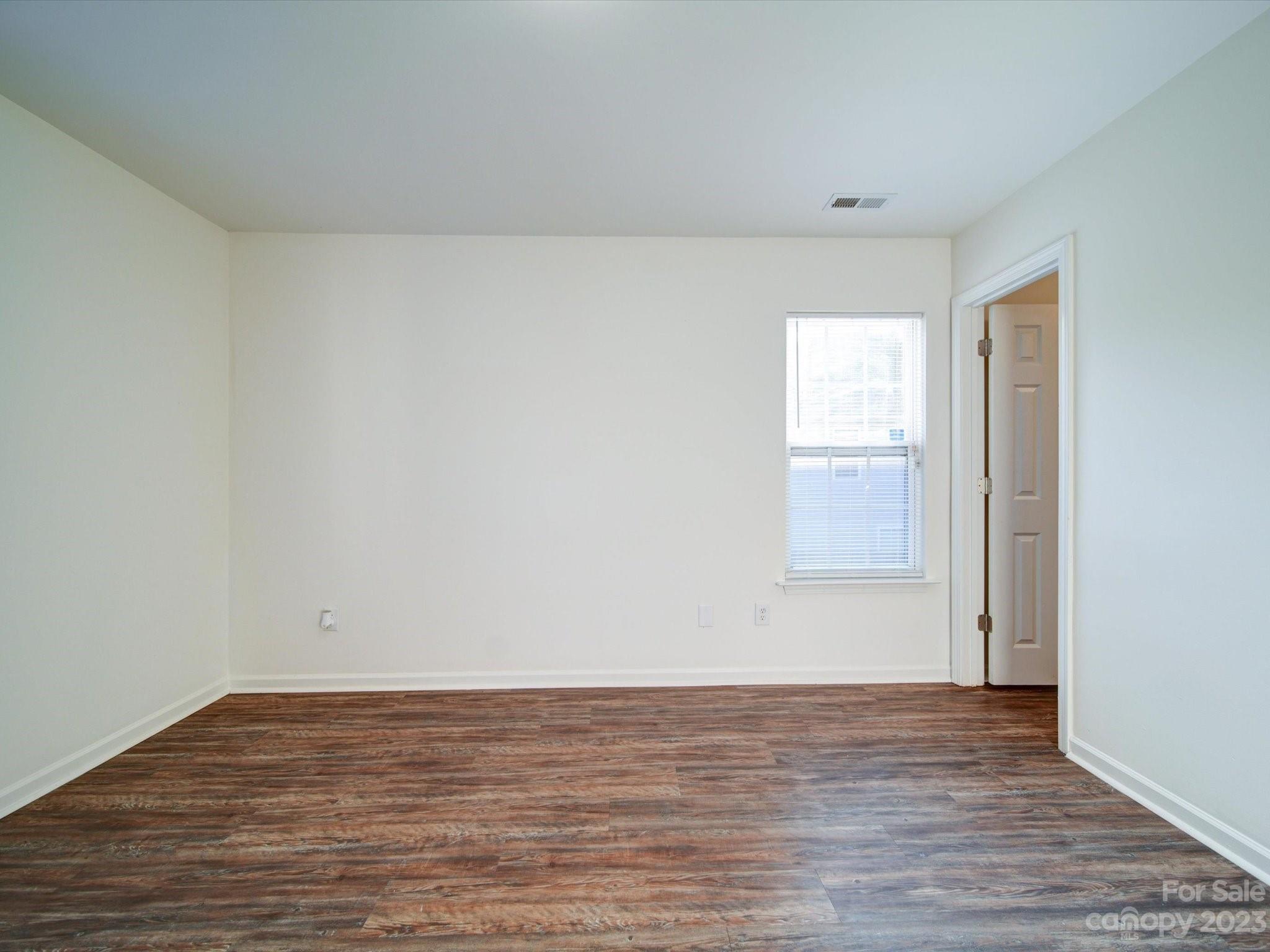 925 Key Street Charlotte, NC 28208 - Photo 18 of 41 a view of an empty room and wooden floor