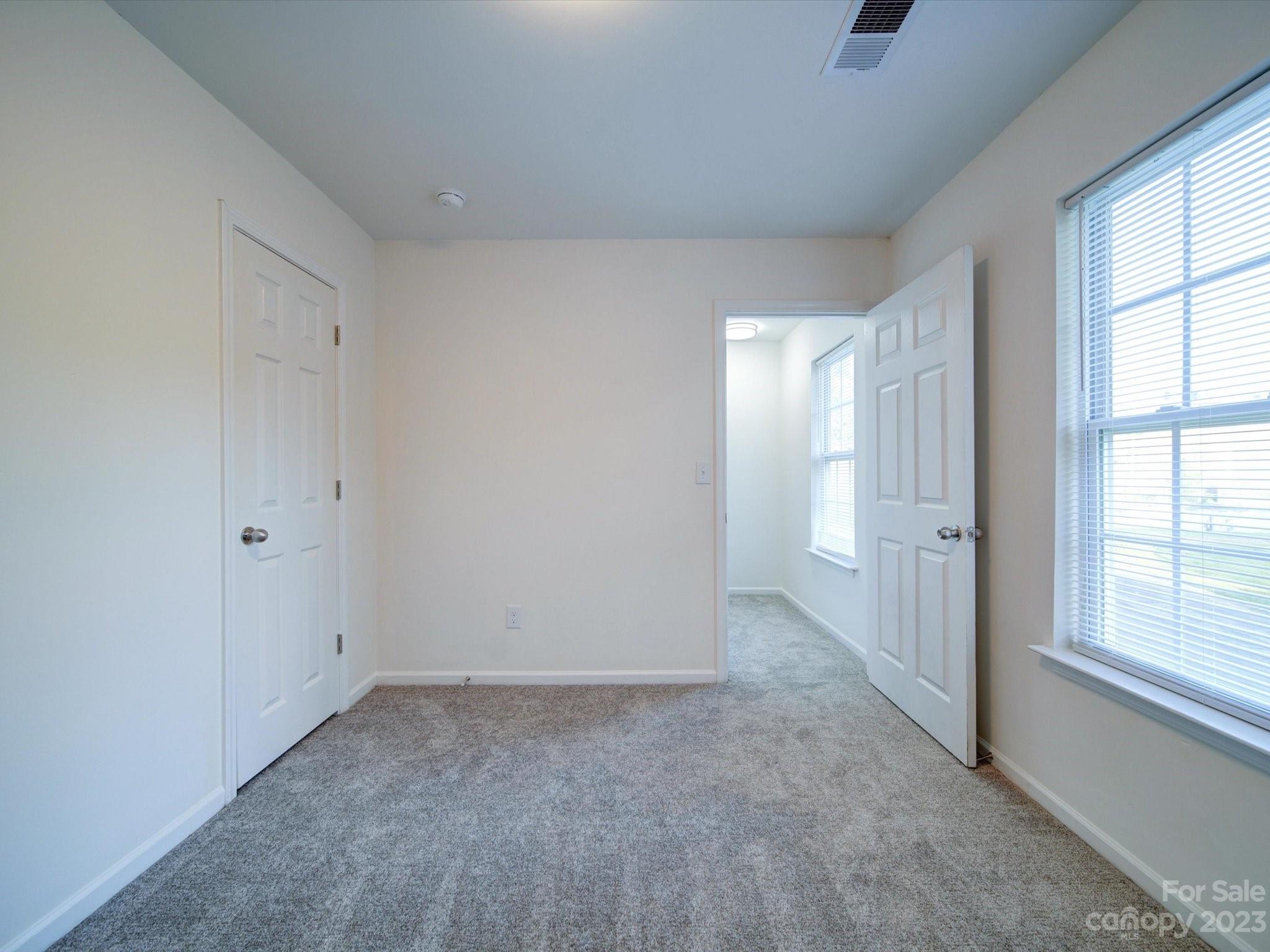 925 Key Street Charlotte, NC 28208 - Photo 24 of 41 an empty room with windows and closet
