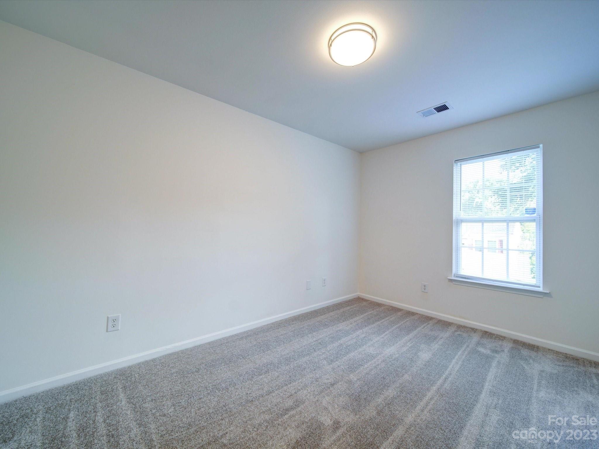 925 Key Street Charlotte, NC 28208 - Photo 31 of 41 an empty room with a window