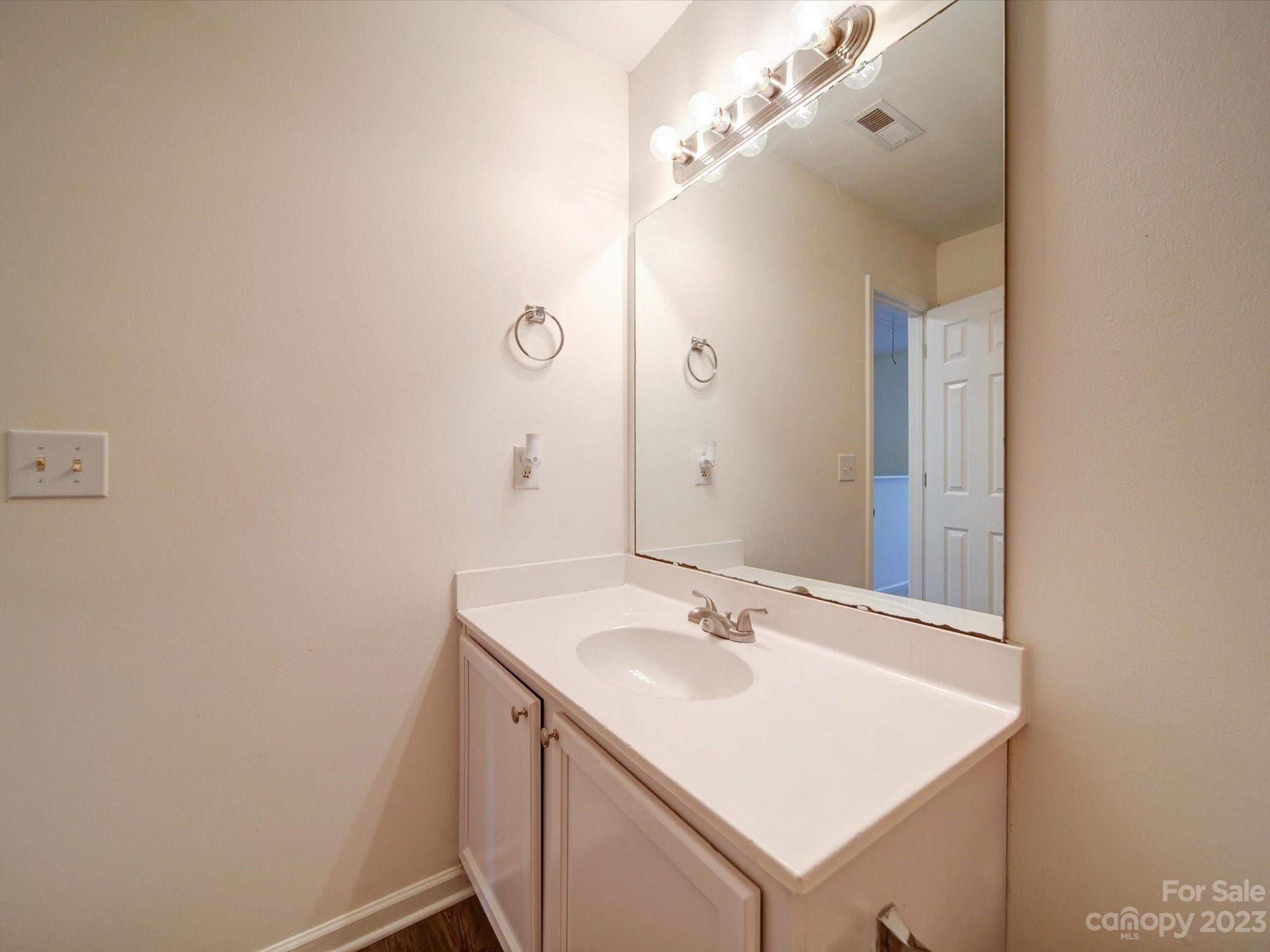 925 Key Street Charlotte, NC 28208 - Photo 35 of 41 a bathroom with a sink and a mirror