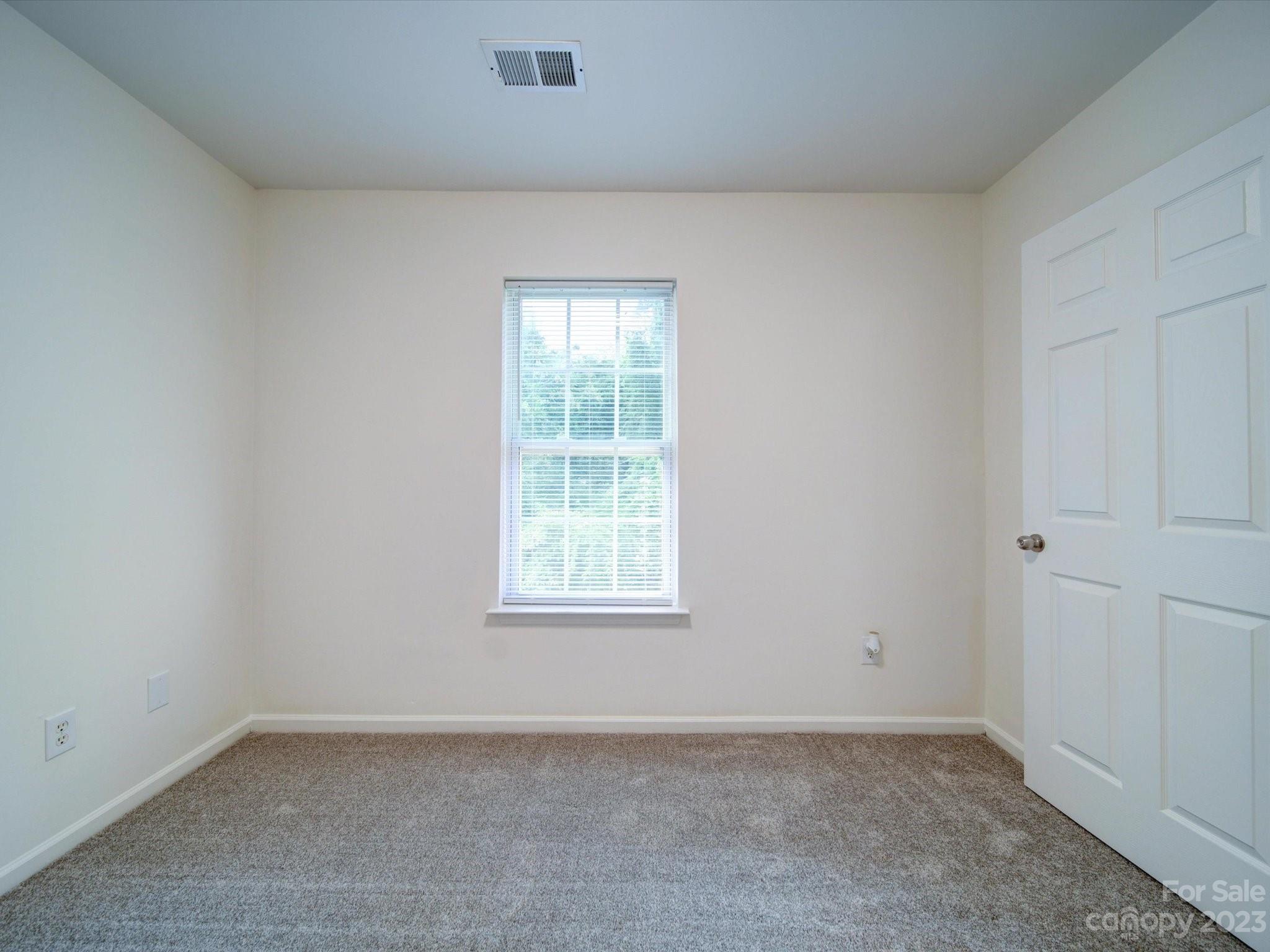 925 Key Street Charlotte, NC 28208 - Photo 37 of 41 an empty room with a window