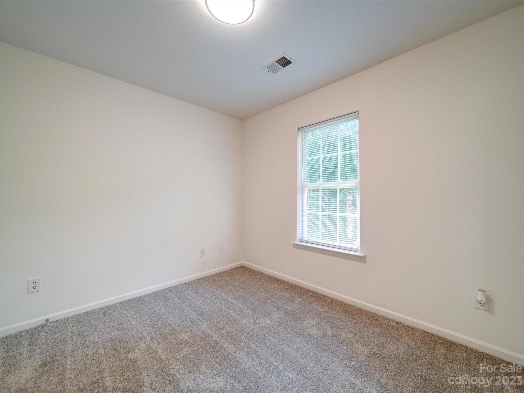 925 Key Street Charlotte, NC 28208 - Photo 38 of 41 an empty room with a window