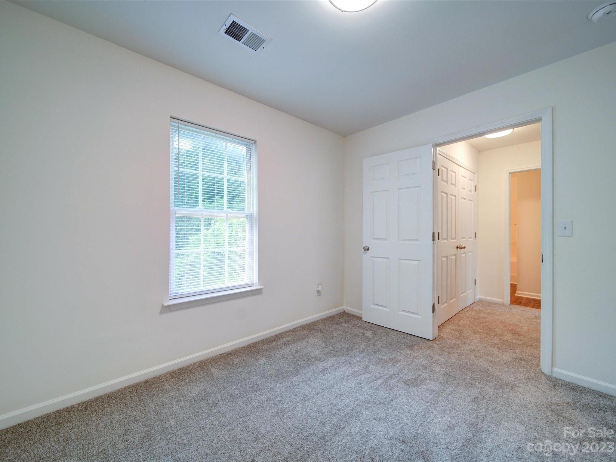 925 Key Street Charlotte, NC 28208 - Photo 39 of 41 an empty room with windows