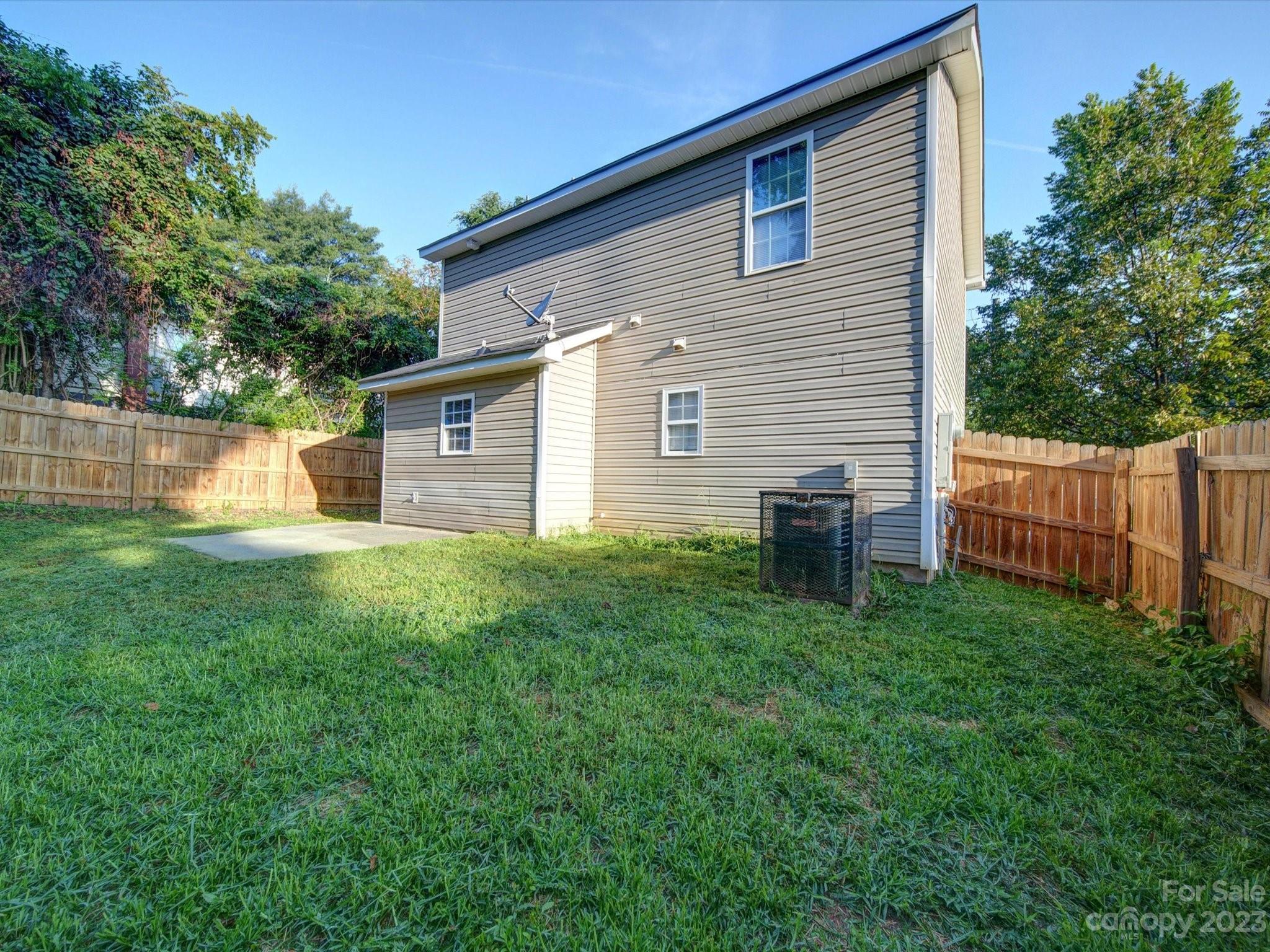925 Key Street Charlotte, NC 28208 - Photo 6 of 41 a view of a house with backyard and a garden