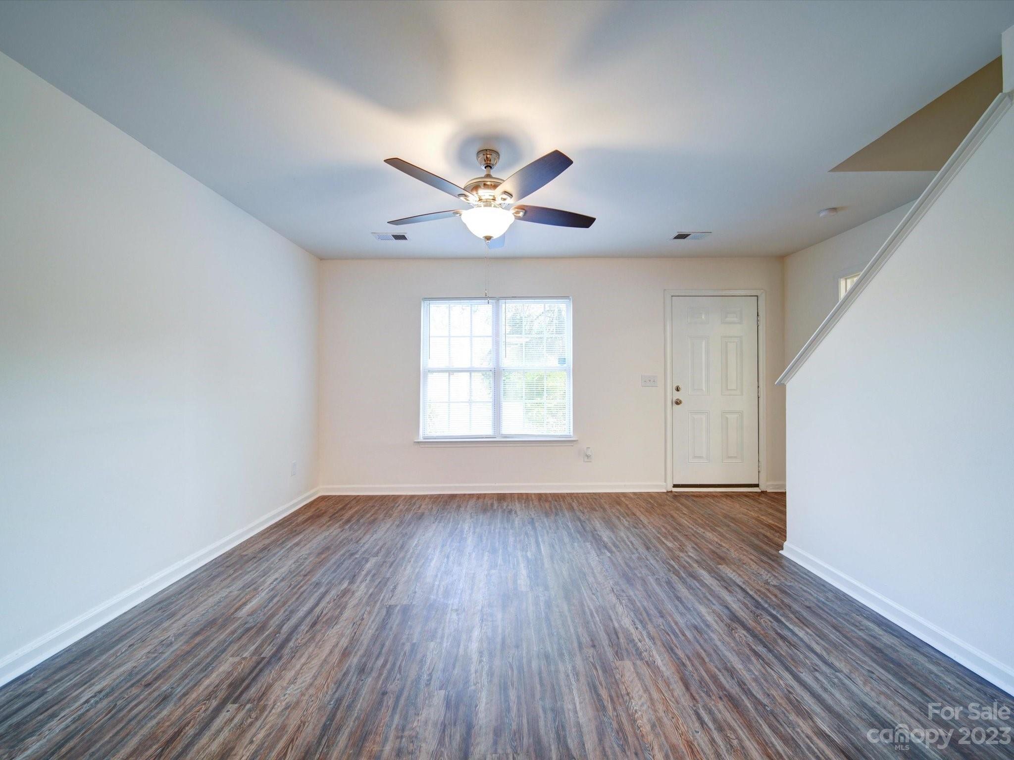 925 Key Street Charlotte, NC 28208 - Photo 8 of 41 an empty room with wooden floor and windows