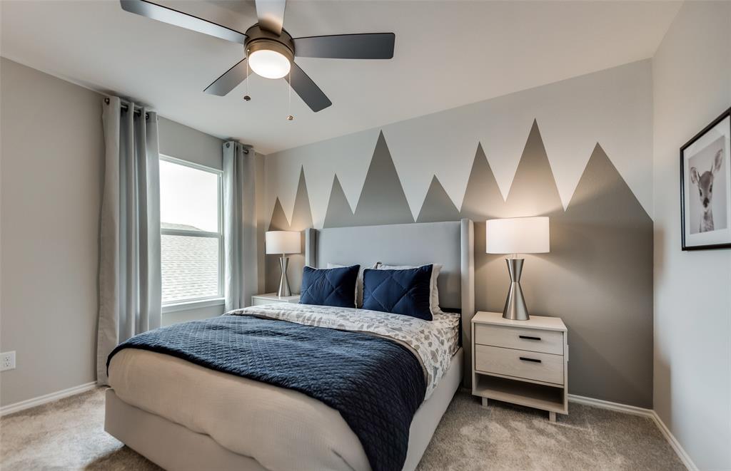 816 Shire Avenue Haslet, TX 76052 - Photo 11 of 23 a bedroom with a bed and a chandelier
