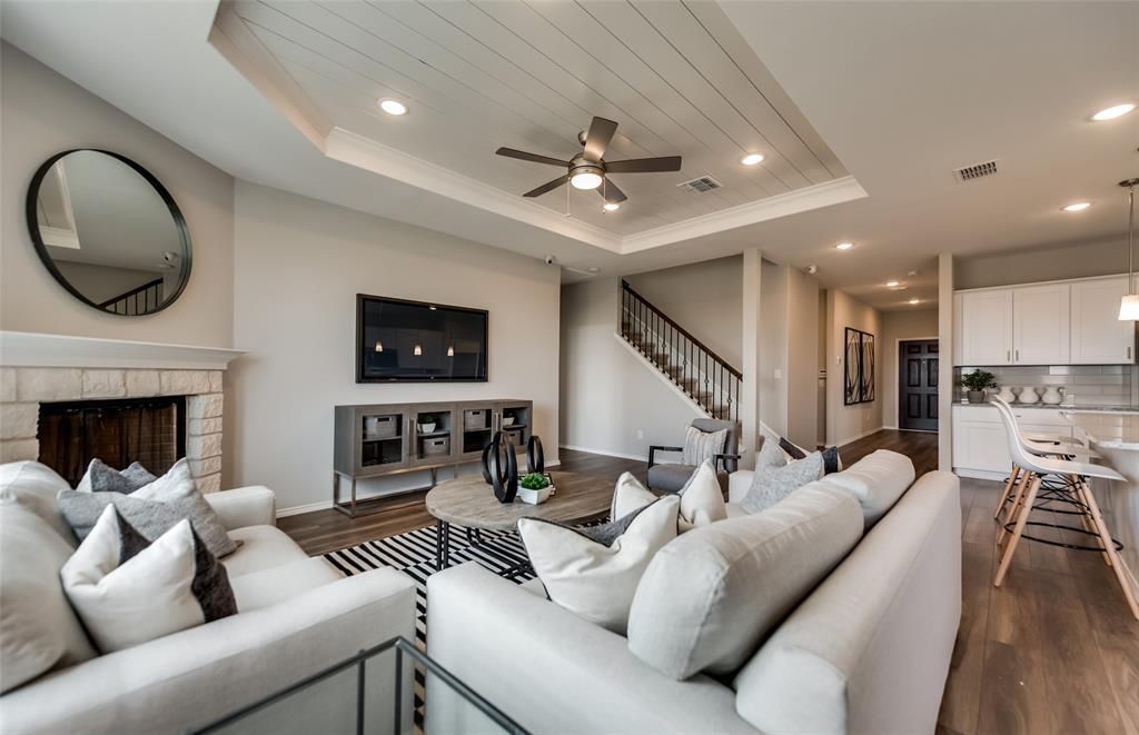 816 Shire Avenue Haslet, TX 76052 - Photo 14 of 23 a living room with furniture a fireplace and a flat screen tv