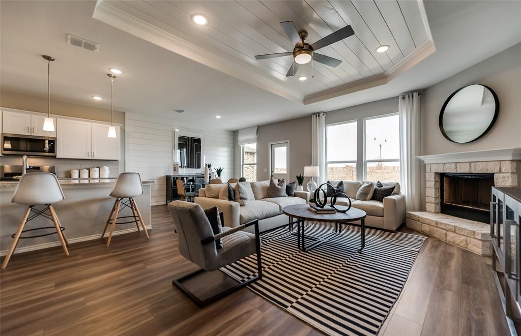 816 Shire Avenue Haslet, TX 76052 - Photo 15 of 23 a living room with furniture a fireplace a rug and a window