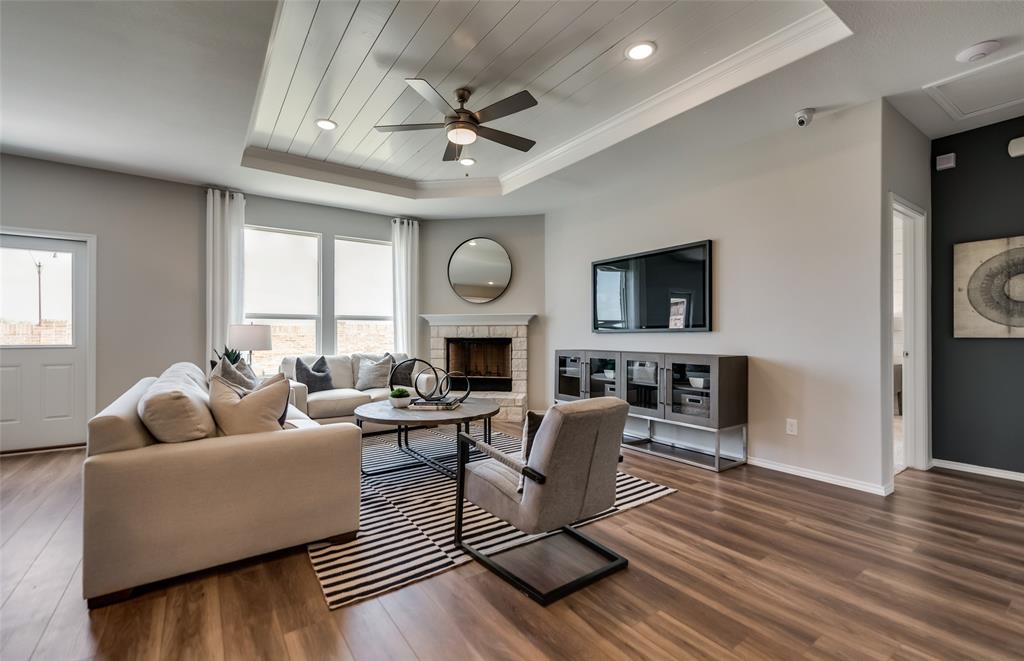 816 Shire Avenue Haslet, TX 76052 - Photo 16 of 23 a living room with fireplace furniture and a flat screen tv