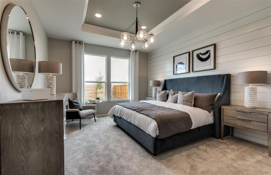 816 Shire Avenue Haslet, TX 76052 - Photo 17 of 23 a spacious bedroom with a bed a window and couch