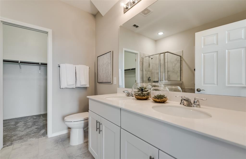 816 Shire Avenue Haslet, TX 76052 - Photo 18 of 23 a bathroom with a toilet sink double vanity and mirror