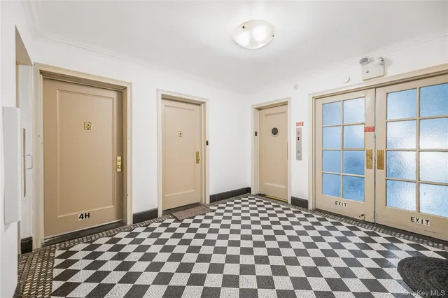a bathroom with a black and white checkered floor