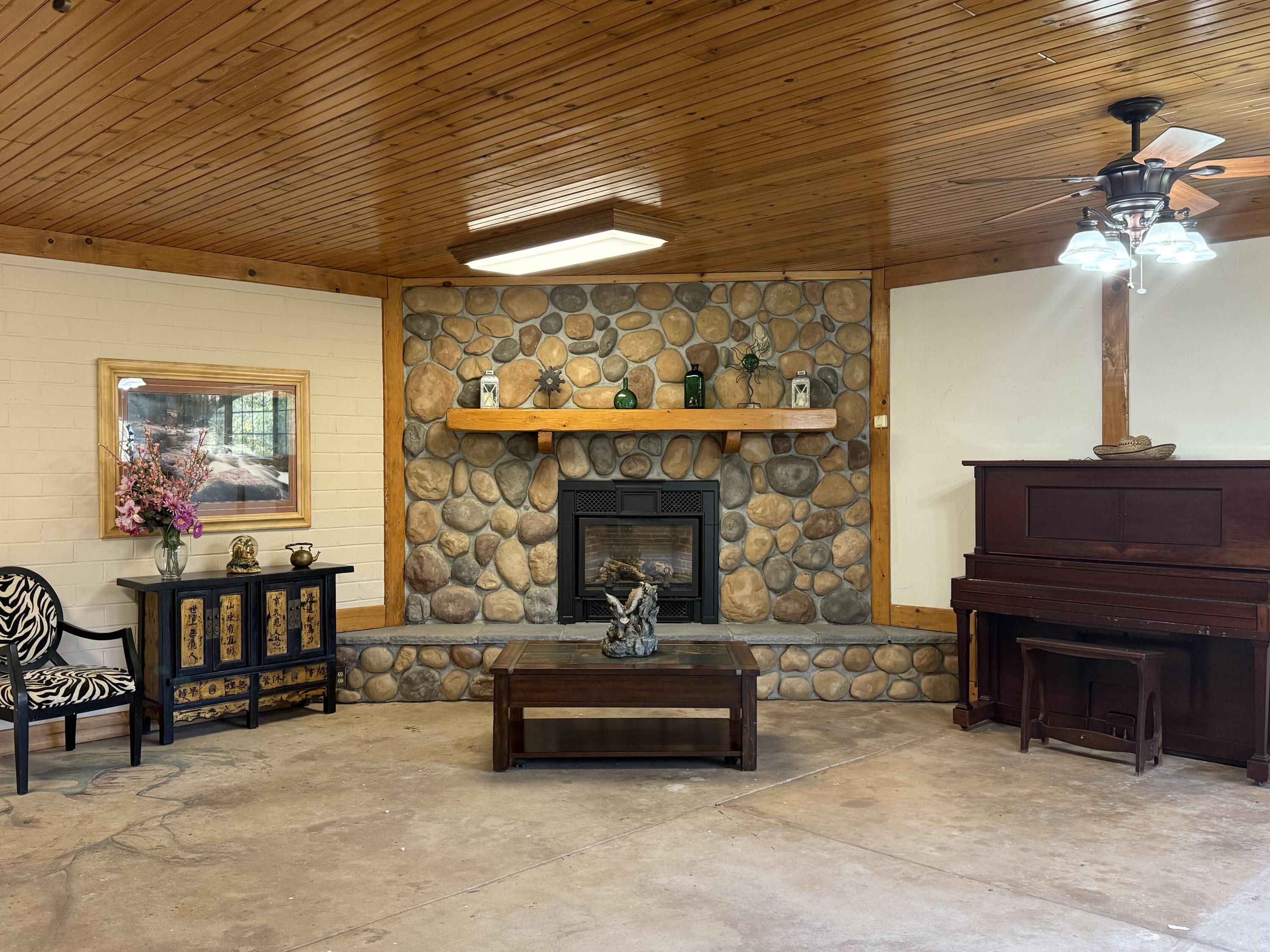 42751 North Fork Drive Three Rivers, CA 93271 - Photo 8 of 13 a living room with furniture and a fireplace