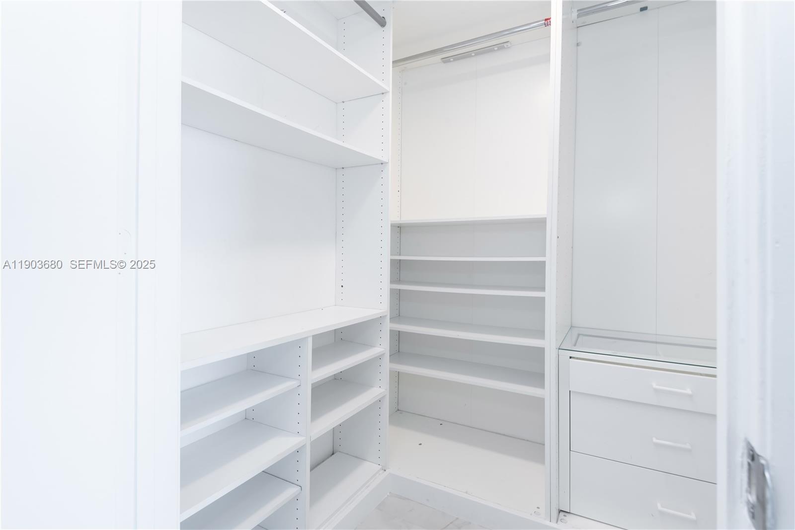 465 Brickell Avenue, Unit 1705 Miami, FL 33131 - Photo 11 of 34 a view of walk in closet with empty racks