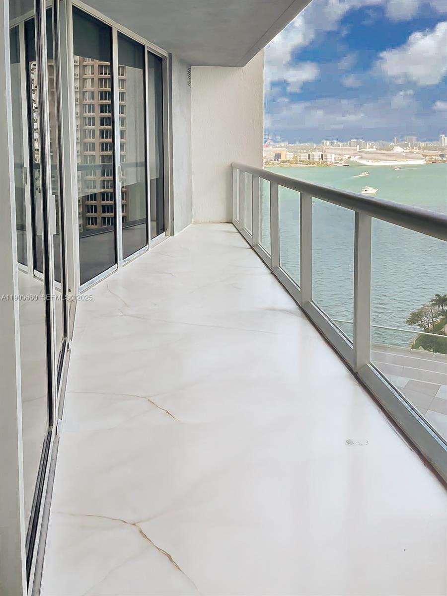 465 Brickell Avenue, Unit 1705 Miami, FL 33131 - Photo 12 of 34 a view of balcony with floor to ceiling window