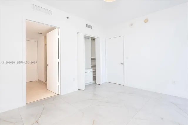 a bathroom with a sink a vanity and a bathtub