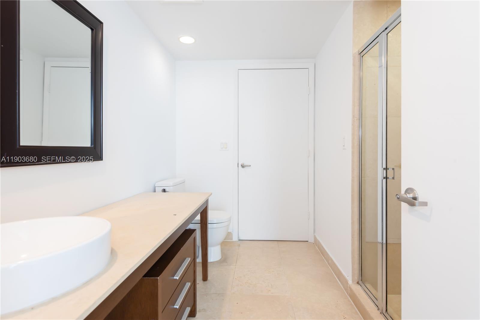 465 Brickell Avenue, Unit 1705 Miami, FL 33131 - Photo 17 of 34 a bathroom with a sink a vanity and a bathtub