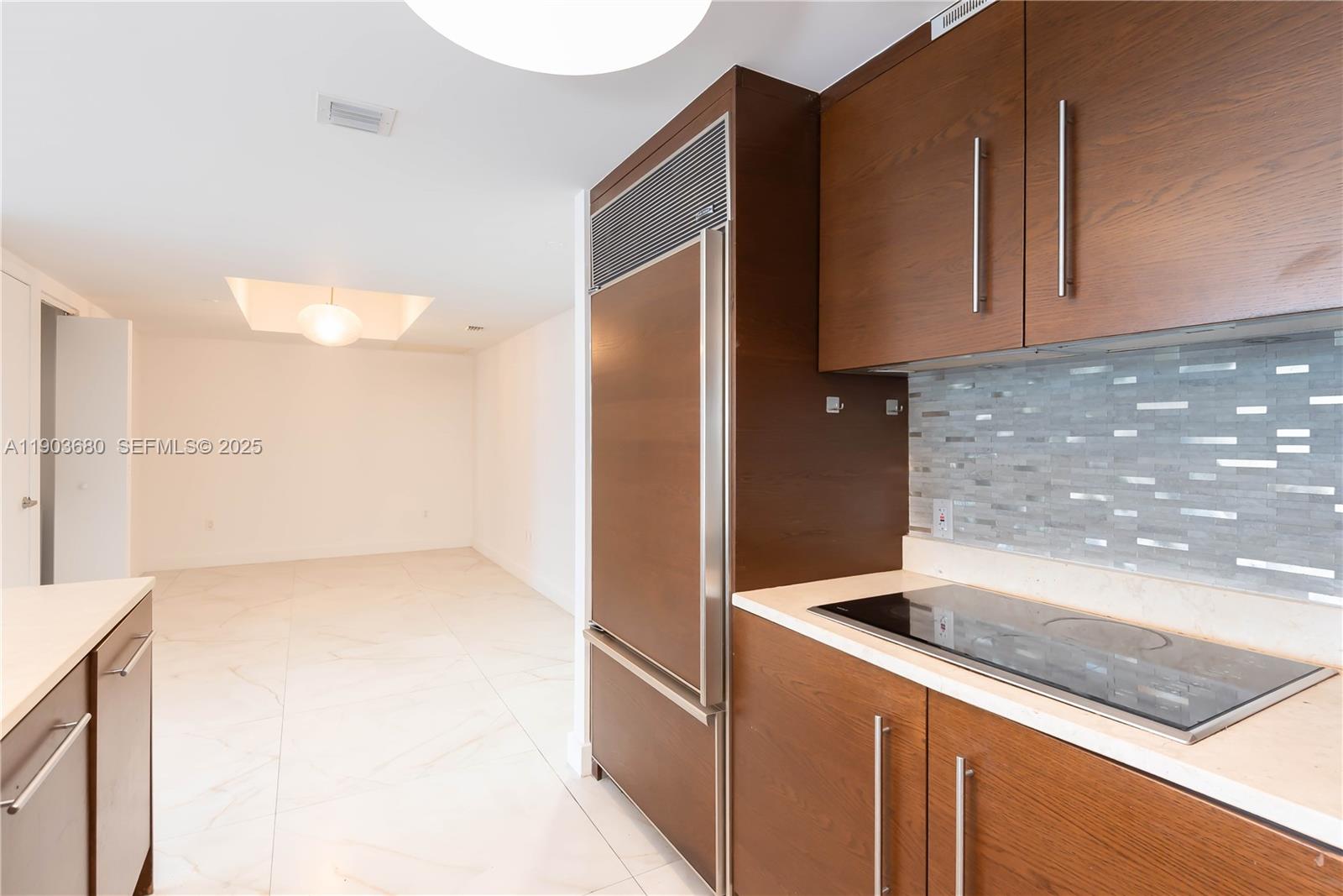 465 Brickell Avenue, Unit 1705 Miami, FL 33131 - Photo 20 of 34 a kitchen with granite countertop cabinets and sink