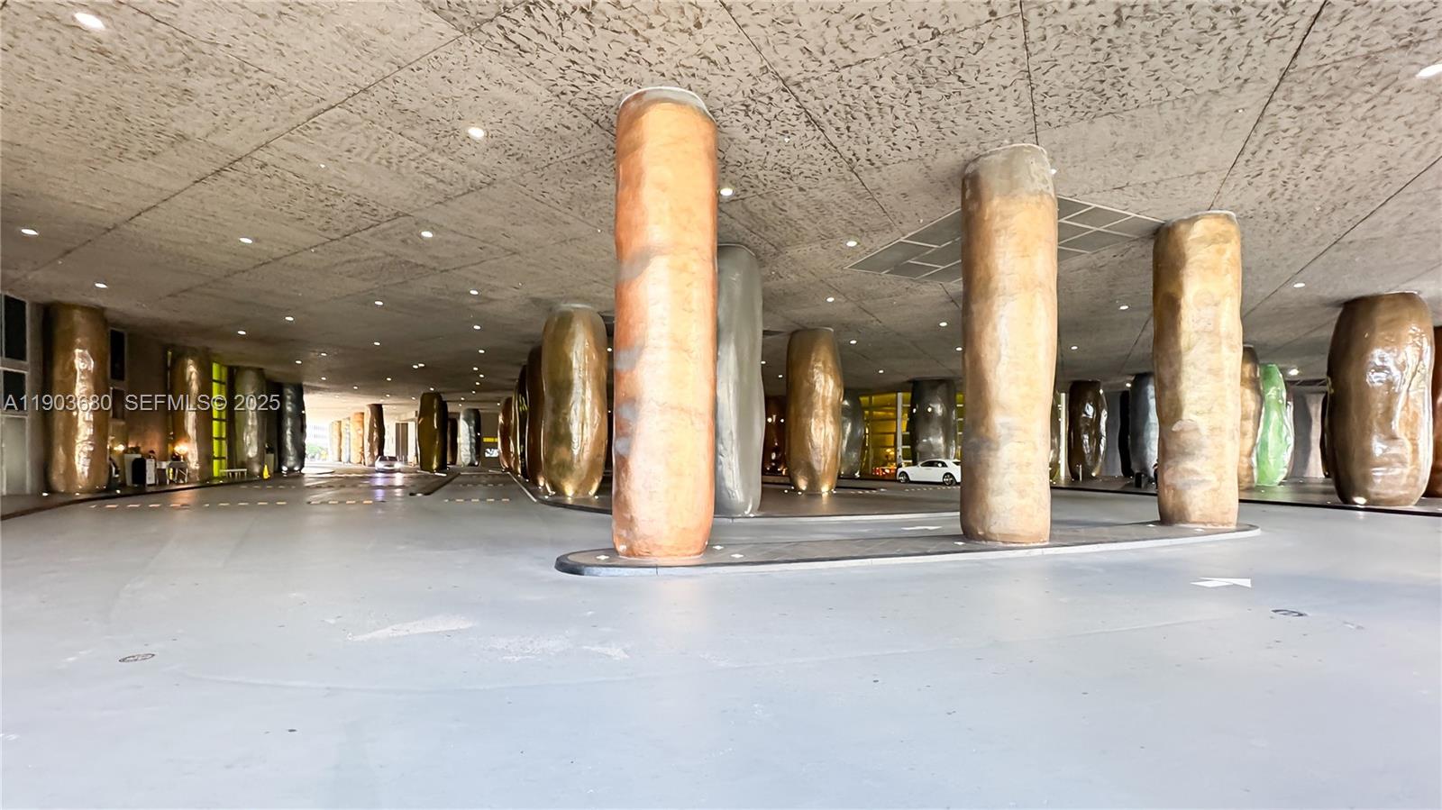 465 Brickell Avenue, Unit 1705 Miami, FL 33131 - Photo 25 of 34 a view of a hall with a floor to ceiling window and a room