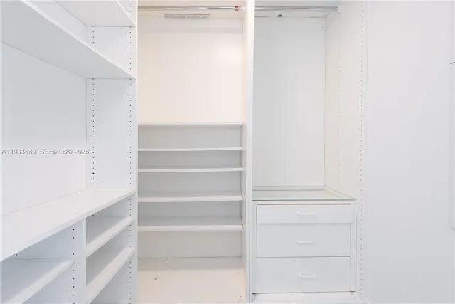a bathroom with a bathtub sink and a mirror