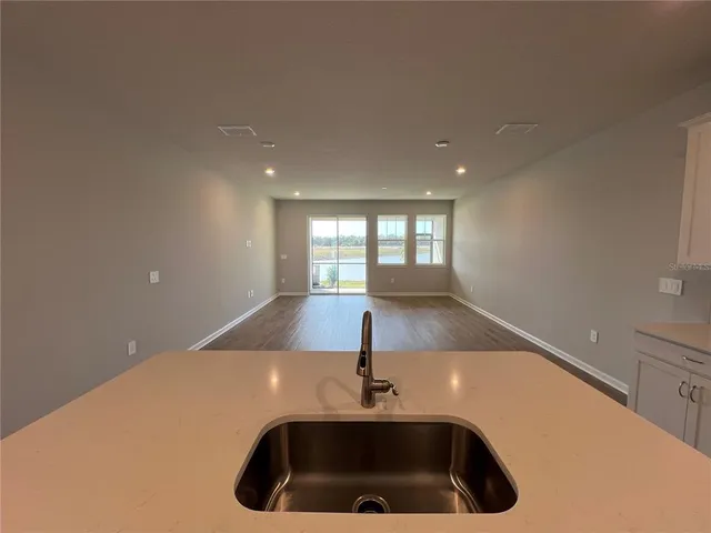 a sink sitting next to a window