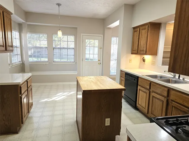 a spacious bathroom with a tub sink and mirror