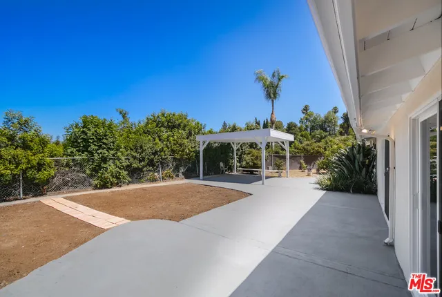 a view of a backyard with a patio