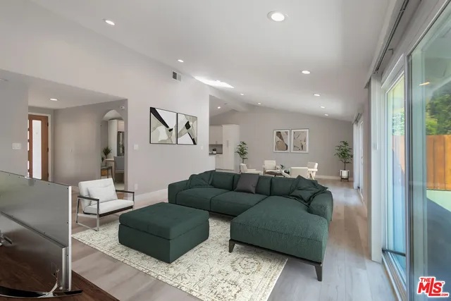 a living room with furniture and a rug