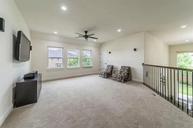 a spacious bathroom with a tub sink and mirror