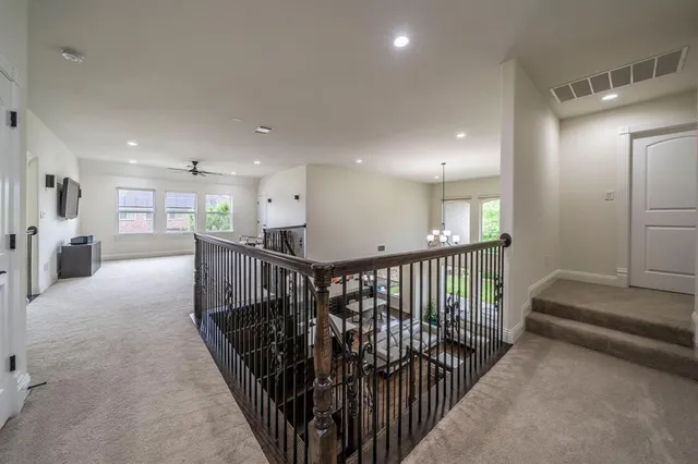 a view of a livingroom with furniture and windows