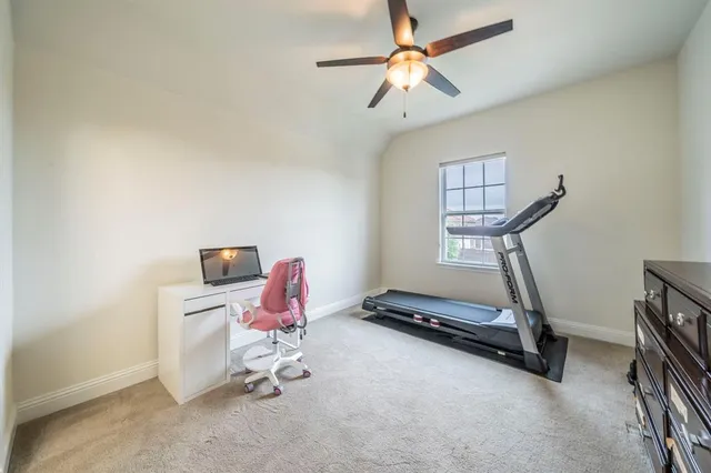 a view of a hallway with seating area