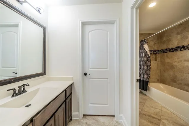 a room with gym equipment and a flat screen tv
