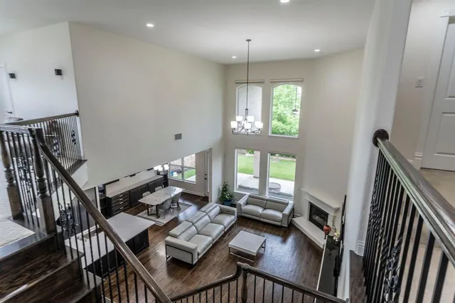 a workspace with wooden floor and a window