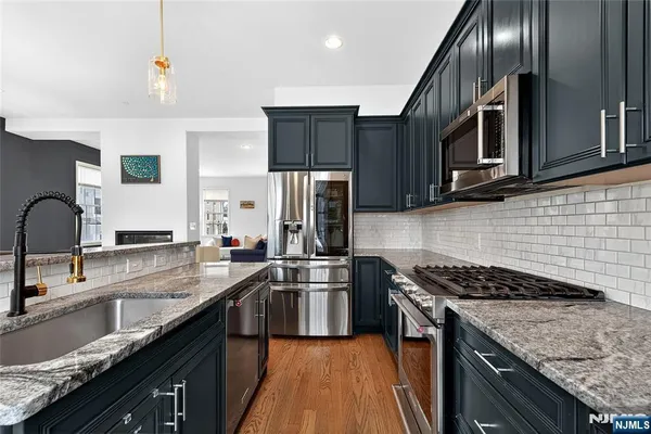 a kitchen with a stove and a microwave