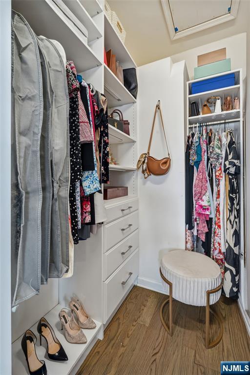 165 Roosevelt Drive Wood-Ridge, NJ 07075 - Photo 32 of 50 a view of walk in closet with clothes and shoes