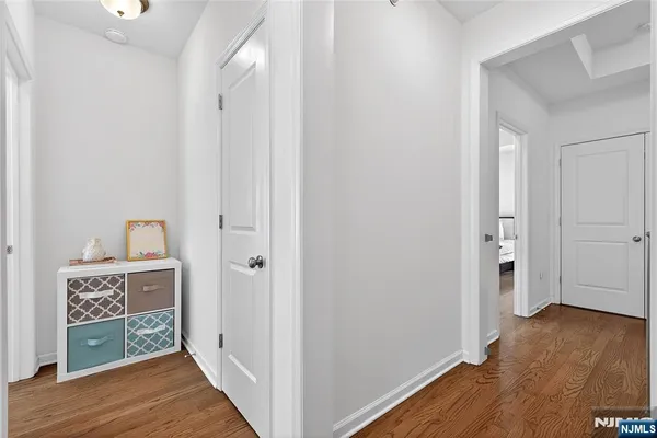 a bedroom with a bed and a night stand