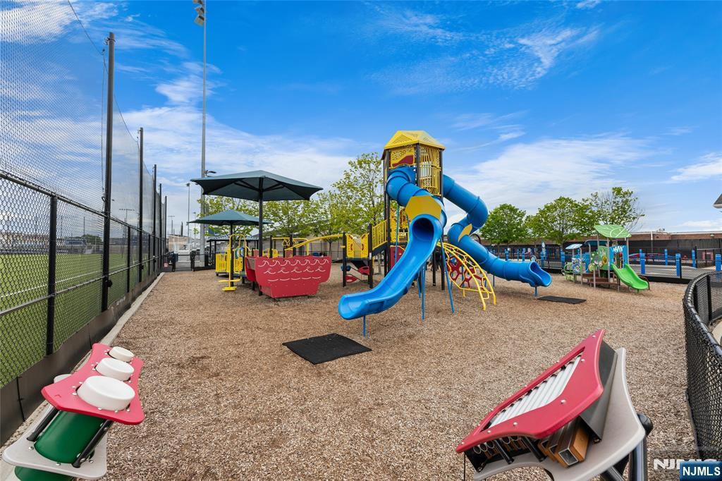 165 Roosevelt Drive Wood-Ridge, NJ 07075 - Photo 49 of 50 a play ground with potted plants