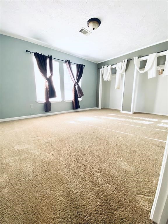 88 Gazebo Street, Unit C Huntsville, TX 77340 - Photo 7 of 12 a view of an empty room with stairs