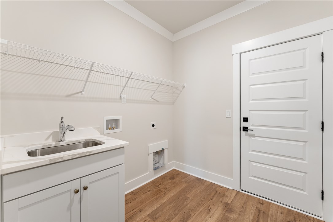 319 Summerall Drive Anderson, SC 29621 - Photo 14 of 37 This bright utility room features a functional sink and durable flooring.