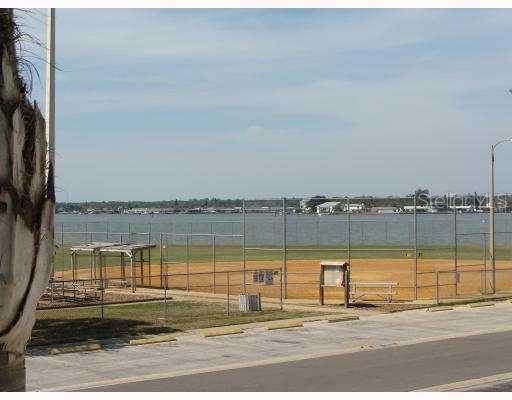 303 Rex Place, Unit 5 Madeira Beach, FL 33708 - Photo 1 of 1 Exterior Front - View of waterfront Baseball field!