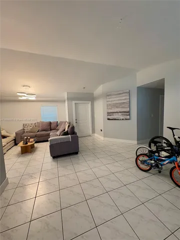 a bedroom with furniture and a dresser