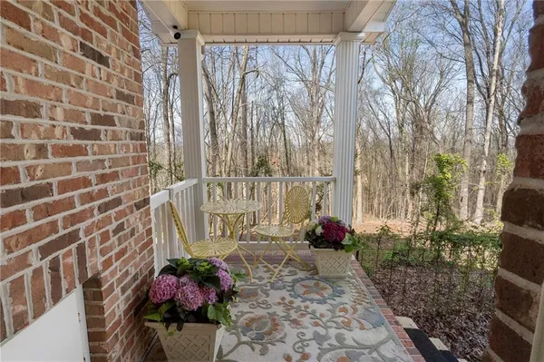 a view of a brick house with a yard