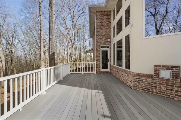 a view of a balcony with wooden floor