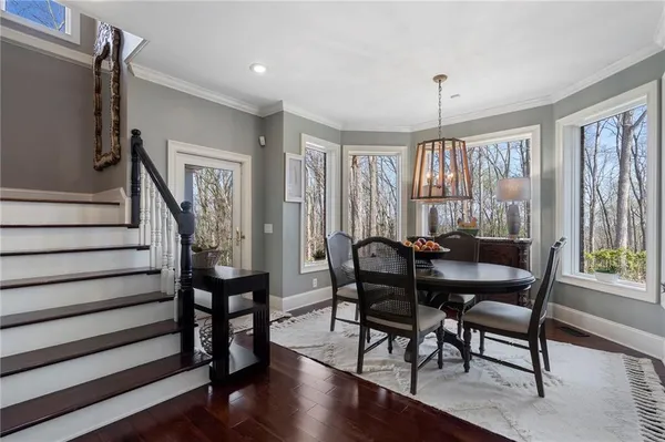 a view of a dining room with furniture window and wooden floor