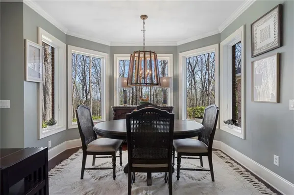 a dining room with furniture and window