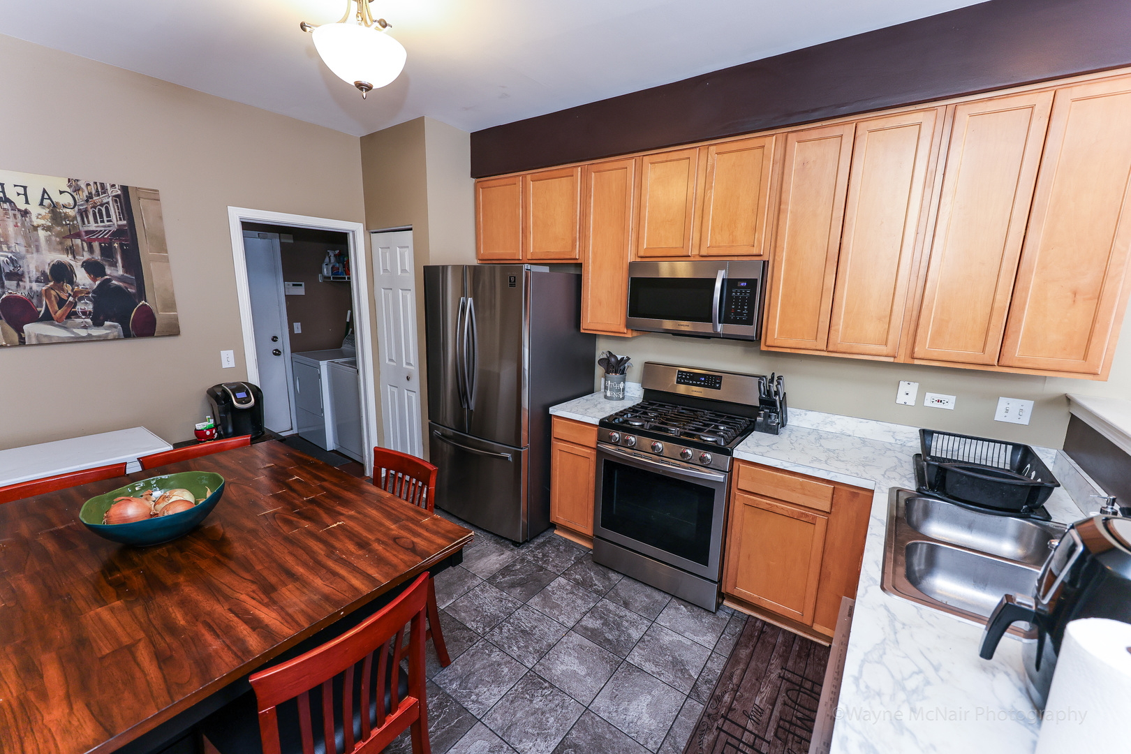 195 Key Largo Drive Romeoville, IL 60446 - Photo 14 of 34 a kitchen with stainless steel appliances granite countertop a stove refrigerator and a microwave